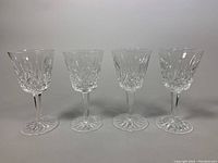 Front view of all four crystal wine glasses in a row
