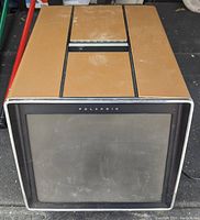 Front and top view of the 1977 Polaroid Polavision player showing the screen and upper panel with buttons and branding.