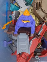 Close-up of a purple Hot Wheels track piece with flame logo and ramp