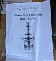 Close-up of SF Pro Series chocolate fountain user guide showing picture of multi-tier fountain.