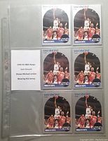 Six Sam Vincent 1990 NBA Hoops basketball cards displayed in a plastic page protector, Michael Jordan seen wearing jersey #12 in the background of all cards.