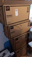 Four large cardboard boxes labeled Medline Fragile Mixed Supplies containing sealed FitRight liners and wipes.