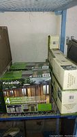 Photo showing boxed sets of solar LED accent lights from Paradise stacked on shelving.