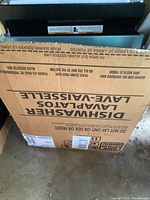 Dishwasher in original box labeled Dishwasher Lavaplatos with handling instructions.