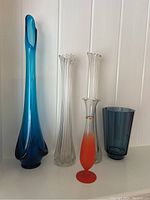 Front overview shot showing all five vases lined up, highlighting variety in height, color and design