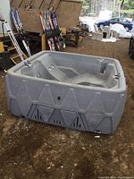 Wide shot of hot tub showing exterior panel and interior seating