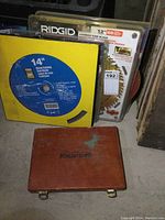 Mastercraft wooden case closed with other saw blade packages behind