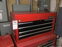 Front view of red Craftsman top toolbox on larger bottom chest, showing six drawers and Craftsman branding