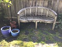 Front view of entire lot showing bench and three planters