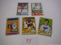 Five Topps hockey cards laid out including Marcel Dionne, Bill Fairbairn, Conn Smythe Trophy card, Yvan Cournoyer, and Jacques Lemaire.