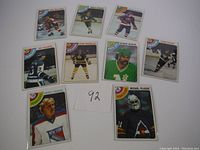 Nine assorted 1978 Topps hockey cards showing players in team uniforms with a number 92 card identifier in the center.