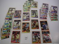 Lot of 33 1984 Topps hockey cards spread on a surface showing player images and team colors.