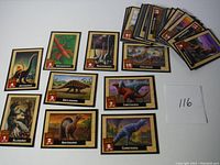 Overview photo showing multiple dinosaur cards from the set including Allosaurus, Apatosaurus, Anatosaurus, Ankylosaurus, Archaeopteryx, Brachiosaurus, Camptosaurus and others.