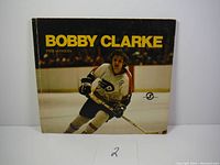 Photo of the book cover showing Bobby Clarke skating on ice in his Flyers uniform.