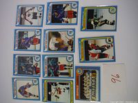 Top view of the 11 hockey cards, showing player photos and logos with team names Buffalo Sabres, New York Rangers, Philadelphia Flyers