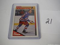Front of Guy Lafleur hockey card showing player skating on ice in New York Rangers uniform.