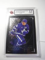 Front view of one graded Mitch Marner hockey card in protective plastic case with a 9.5 grade label by NGM.