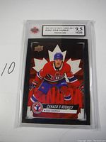 Front view of the Cole Caufield rookie card showing player image and grading label.