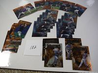 Top view of 26 Topps Finest baseball cards arranged on a white surface showing glossy finish and player images in action poses.