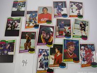 Image showing multiple Topps 1979 NHL hockey cards from various teams spread on a white surface.