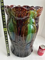 Frontal view showing height of approximately 19 inches next to tape measure and Coca-Cola can for scale