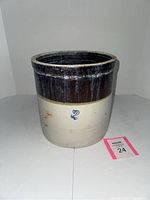 Front view of the stoneware crock showing the two-tone glaze and the blue number '2' stamped on the front.