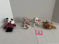 Photo showing all four Beanie Babies (Fortunate, Glory, Rescue, Spunky) arranged on white background with tags visible.