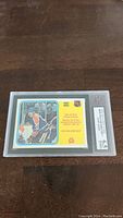 Front side of 1982-83 O-Pee-Chee Wayne Gretzky rookie hockey card in graded slab