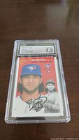 Front view of the Bo Bichette rookie card in plastic grading case labeled 7.5 by CSG.