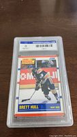 Front view of graded Brett Hull hockey card, shows the card encased in plastic with grade 8 NM-MT from Grademycards.com