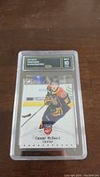Front view of the 2014 Leaf Connor McDavid Young Stars Rookie hockey card showing player image, card details, and GMA 10 grade label.