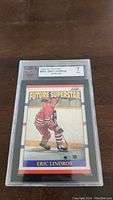Front view of the 1990-91 Score Eric Lindros rookie card graded KSA 7, featuring the player in red uniform with the 'Future Superstar' label.