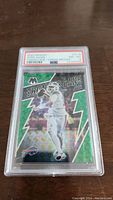Front view of the graded 2022 Panini Mosaic Josh Allen Thunder Lane Green Mosaic trading card with PSA 8 grade and red/white PSA label visible.