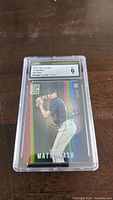 Front view of the Matt Brash rookie short print card graded 9 by CSG in protective plastic casing.