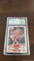 Front view of the 1990-91 Fleer #30 Scottie Pippen basketball card inside a protective case showing the player dribbling the ball with Chicago Bulls uniform. Grading label from Certified Sports Guaranty (CSG) at the top, rated 8.5.