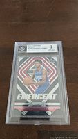 Front view of the graded Shai Gilgeous-Alexander rookie card showing full card design and the BGS label with grade 7 near mint