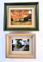 Two framed oil on canvas paintings by Grace McDougall showing autumn tree and country house scenes.