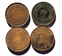 Top-down photo of all four coins showing front sides with date and inscriptions, one 1861 Nova Scotia coin with visible patina next to three Canadian large cents from 1918 and 1919.