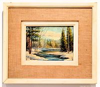 Framed oil painting showing the winter river scene with beige matting and vintage wood frame.
