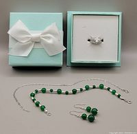 Sterling silver jewellery set including jade bead bracelet, earrings, two-way cubic zirconia ring in gift box.