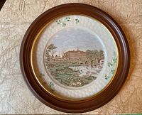 Full view of the framed Belleek collector plate mounted in a wooden frame with glass protection.