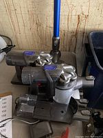 Two Dyson DC-45 vacuum motor units stacked, showing charging port and filters