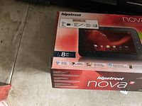 Photo of the sealed Hipstreet Nova tablet box showing model, storage size and WiFi capability.