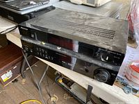 Full perspective shot of the Pioneer stereo receiver showing top and front panel with ventilation and control interface.