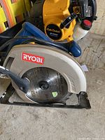 Ryobi circular saw showing side profile with blade guard and handle visible.