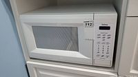 Full view of Galaxy microwave oven showing front door and keypad panel.