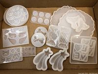 Silicone molds in a cardboard box showing all included shapes.