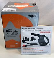Photo of new boxed Ucons Electric Air Duster model ECA-02 with user manual and multiple nozzles visible on packaging.