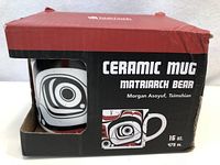 Mug box showing Native Northwest branding and Matriarch Bear ceramic mug artwork with 16 oz capacity.