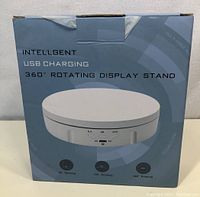 Box showing the product and key features including intelligent USB charging and multiple rotation options